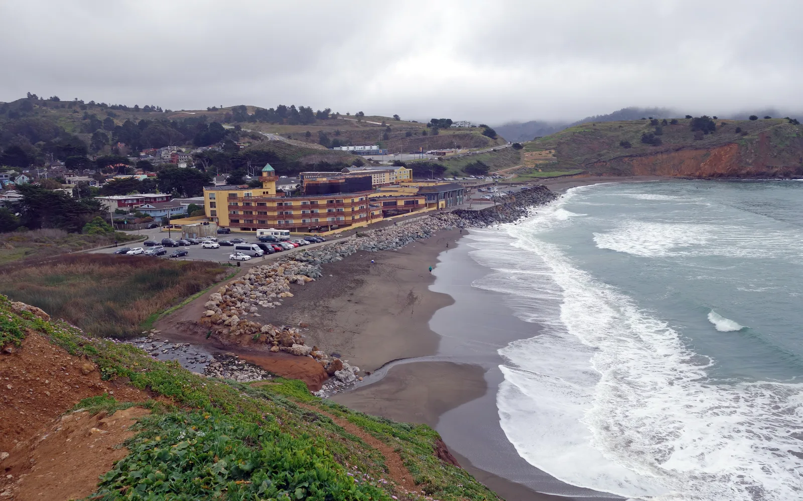 Rockaway Beach in Pacifica with coastal cliffs and sandy shore